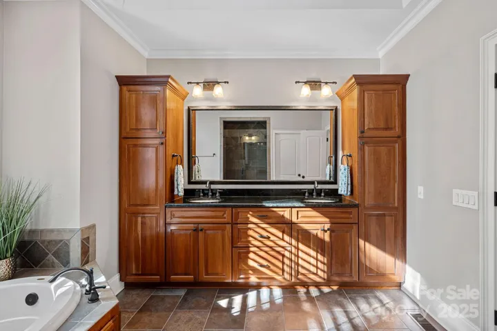 rimary ensuite with large, walk-in shower, garden tub, beautiful custom cabinetry