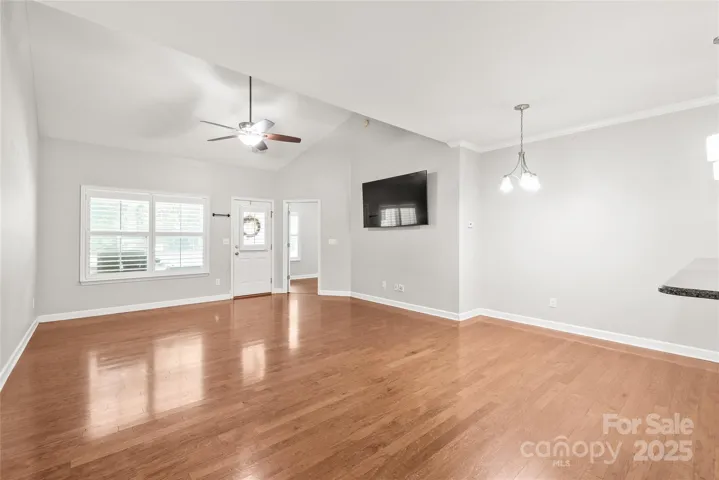 Large open floorplan with vaulted ceiling in the living room.