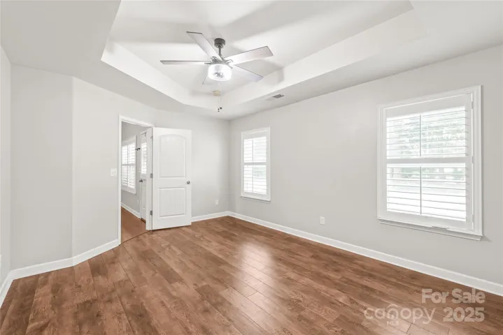 Another view of the primary bedroom without furniture.