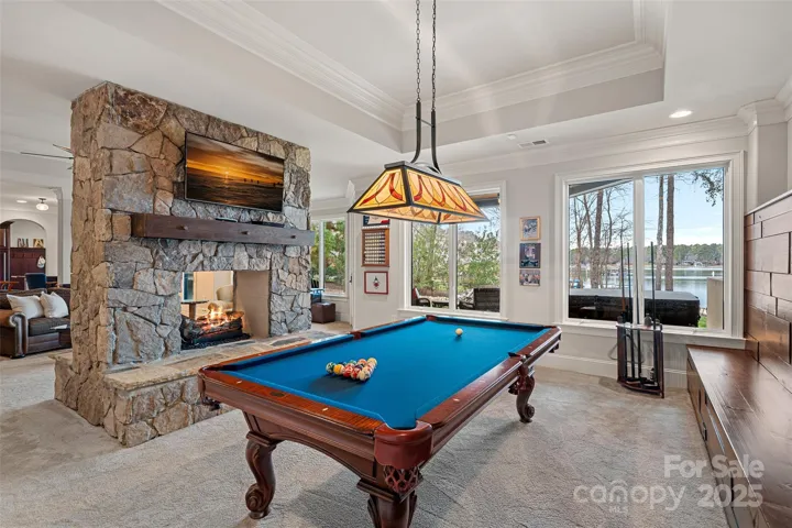 Basement Billards area with see-through fireplace