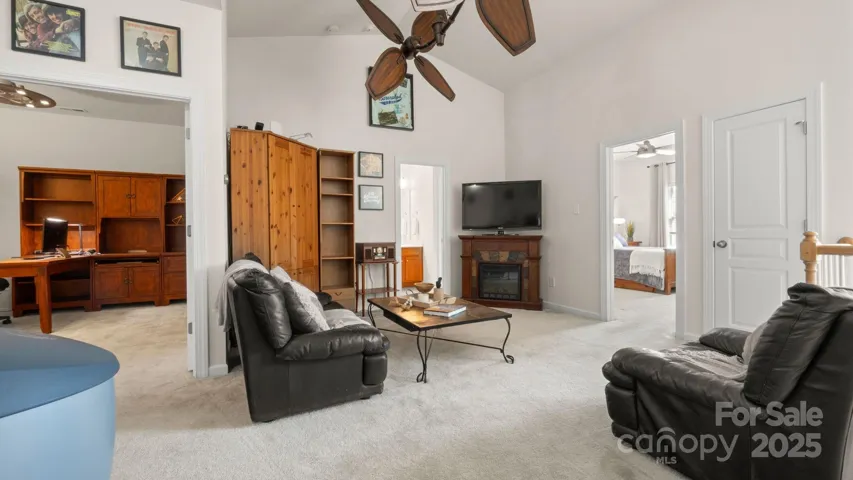 Large loft space being used as 2nd living room. Perfect for entertaining! Leads to 2 upstairs bedroom, flex/office space, and full bathroom