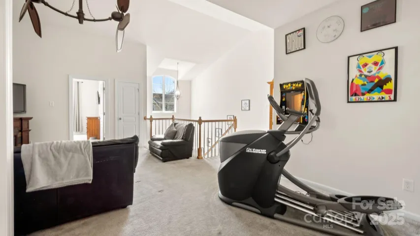 Soaring 2 story foyer leads upstairs to spacious open loft with room for exercise, games, and media!