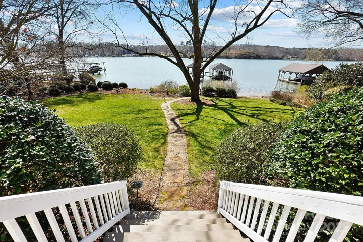 Beautifully landscaped, level yard equipped with landscape lighting is perfect for entertaining