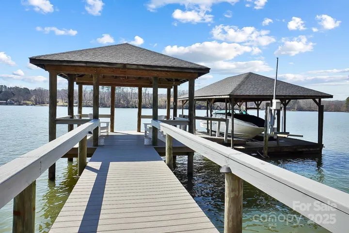 Your private covered dock, complete with a boat lift and jet ski lift, invites you to explore the waters of Lake Wylie