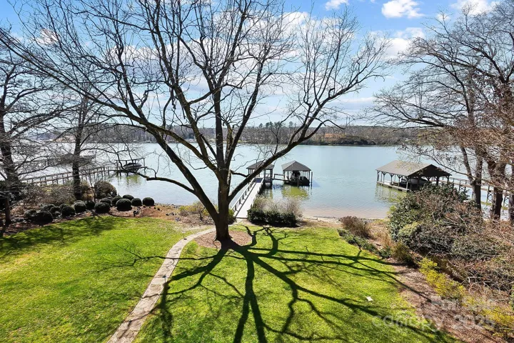 The beautifully landscaped, level yard provides a serene backdrop for outdoor enjoyment