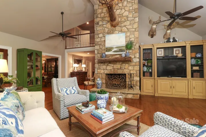 Great room with stacked stone fireplace