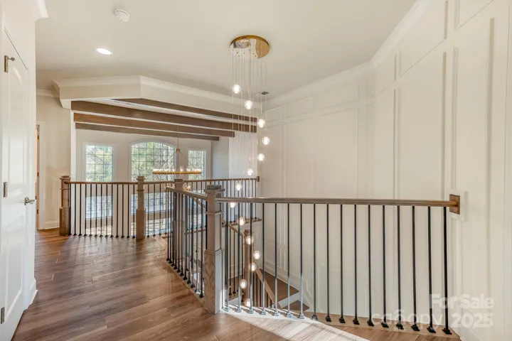 Upstairs foyer with balcony overlooking living room