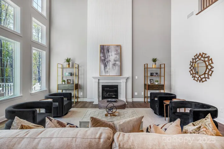 Living space featuring a custom fireplace with detailed surround