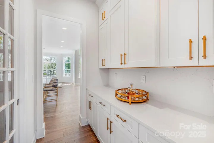 Butler’s area and walk-in pantry offering extra prep and storage space.