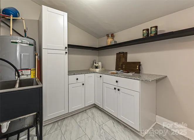 Scullery/mud room off kitchen and has exterior door to load groceries!
