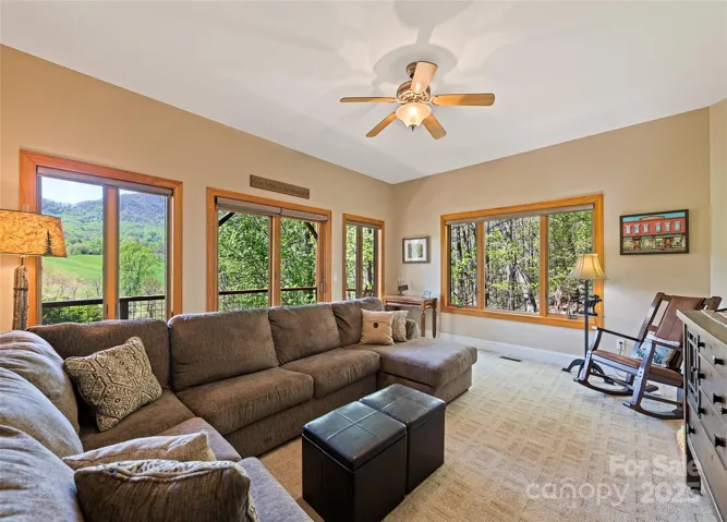 Den downstairs with lots of windows and views