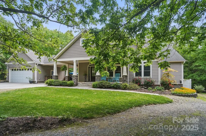 Custom craftsman style home on a private wooded lot