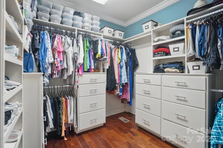 Walk in closet in primary suite