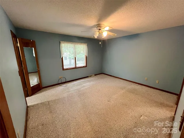 Primary Bedroom - mirror door to walk-in closet