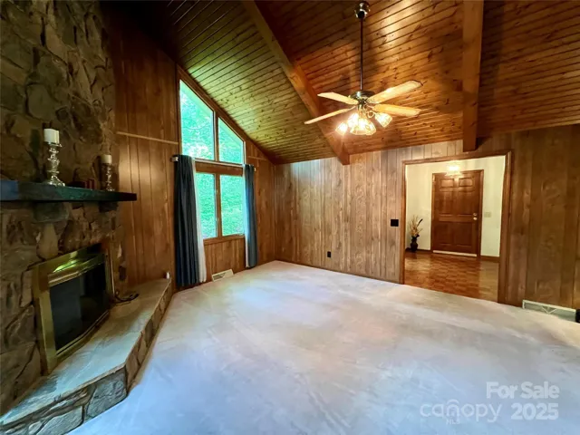 Living Room - Fireplace, Foyer (door leads to garage) with Front Door to the left and the back door on the right