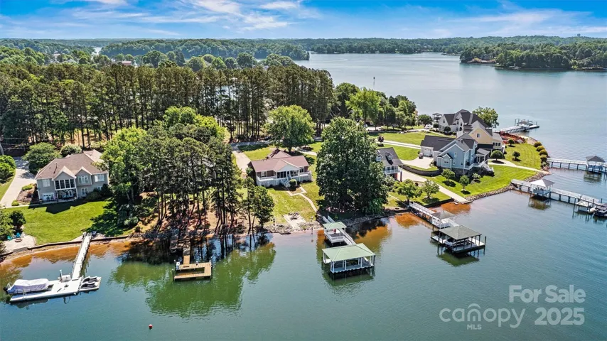 Fabulous deep water cove that opens to the main channel on Lake Norman. Covered Boat Dock With HydroHoist Boat Lift.9561 Island Point Rd. Sherrills Ford NC 28673