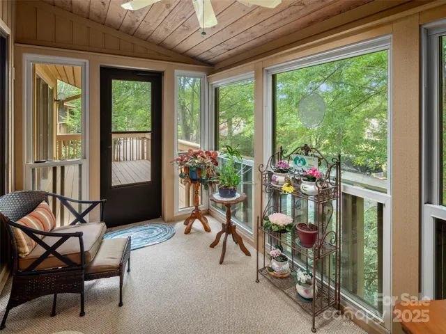 Relax in 3 Season Sunroom with Treehouse Feel