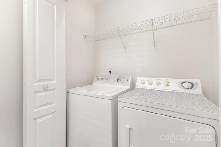 Washer and dryer convey with property and are located on upper level!