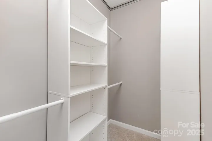 Primary closet has custom built-ins, providing ample storage!