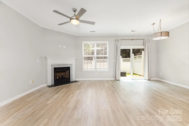 Updated sliding doors provide access to the back yard, with portable fire pit, and privacy fencing!