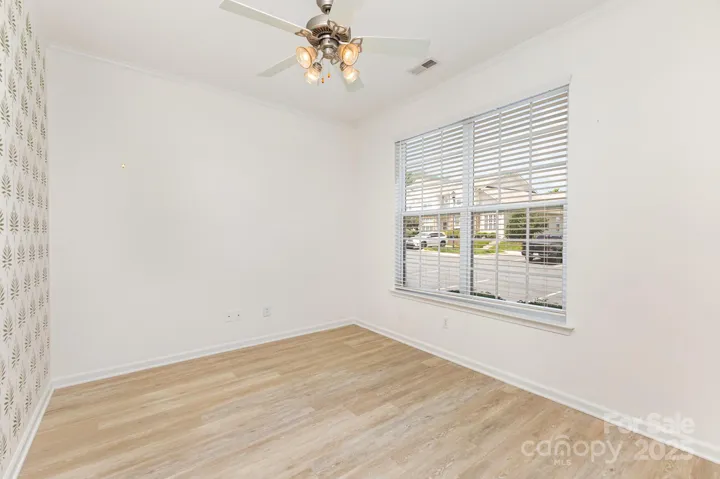 Custom stencil on the wall to the left in the front room adds character and interest!