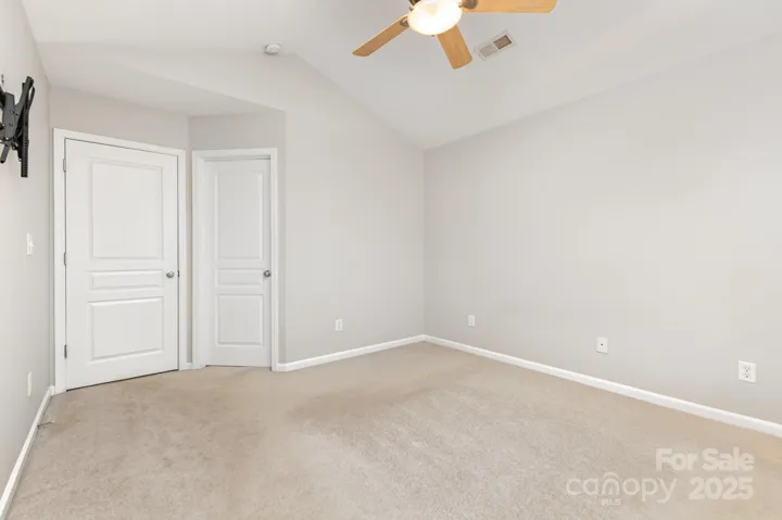 Primary bedroom entrance and closet entrance.