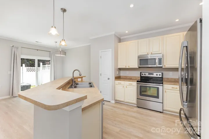 Freshly painted cabinets with new pulls for an updated look! Stainless Steel appliances!