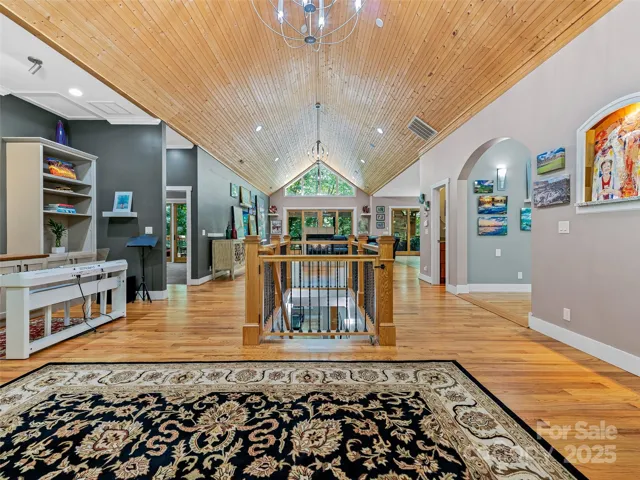 16ft tall cathedral ceilings and oak hardwood floors run the lenght of the Great Room and Foyer
