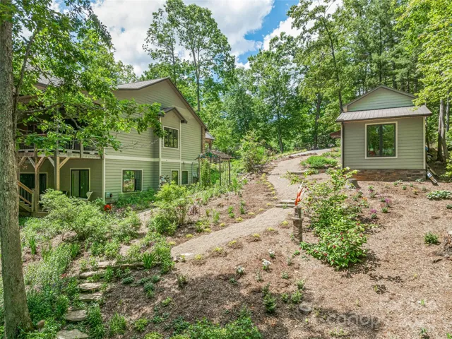 Manicured stone path leading down to fire pit