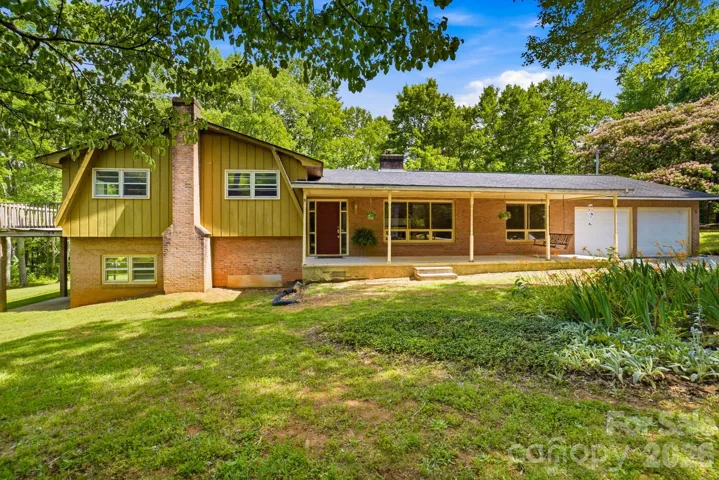Relax, unwind, and enjoy the view from the front porch of this inviting split-level home.
