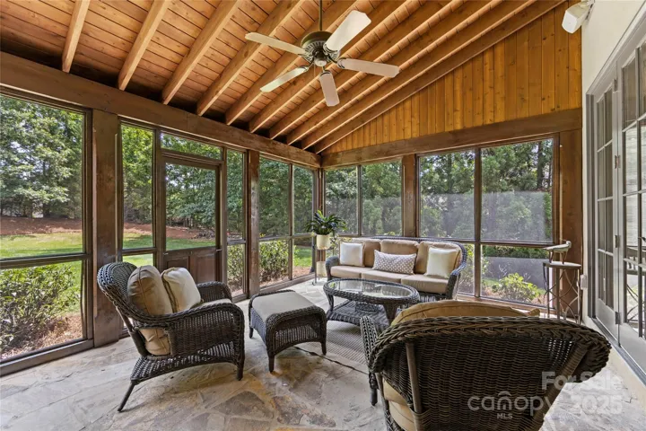 The screened porch with slate flooring extends the living space and is easy to enjoy in the Carolina weather.