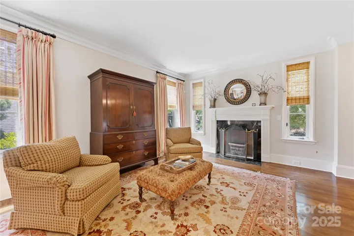 The living room also features a fireplace. Hardwoods run throughout the main home.