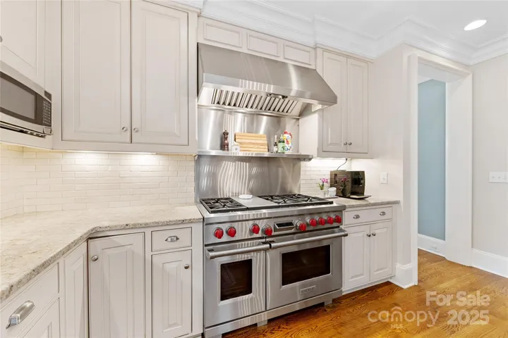 Top of the line appliances include a Wolfe 6-burner gas range,  a Sub-zero built-in fridge, & a Miele dishwasher.