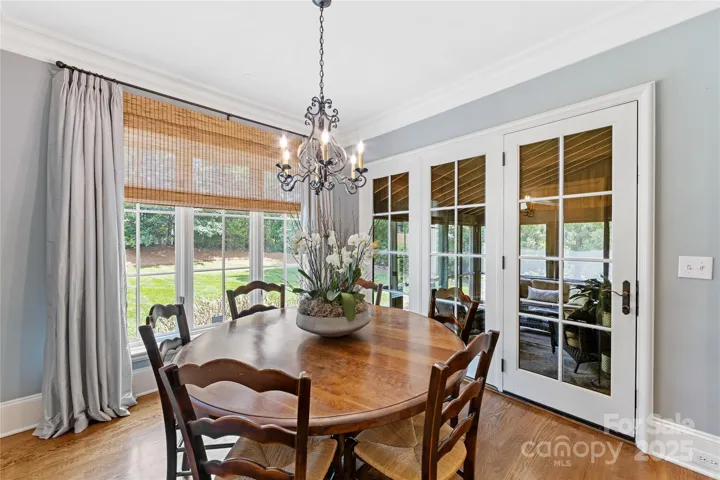 The breakfast nook overlooks the lush backyard & the screened porch.