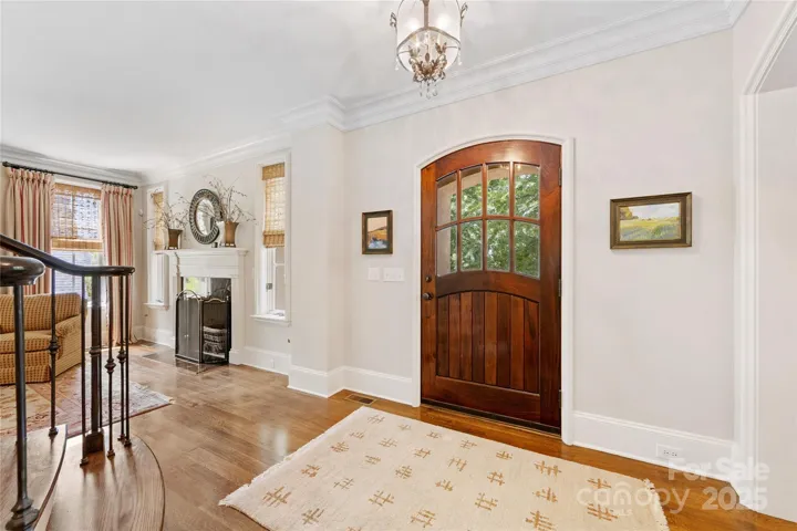 The beautiful foyer is flanked by formal dining and living rooms.