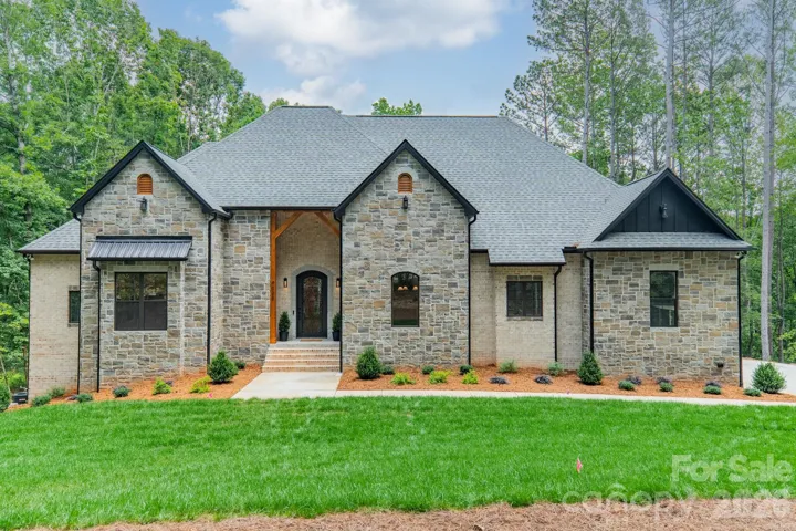 Welcome home to your stunning Lake Norman Estate on 2.03 acres of lakefront living!