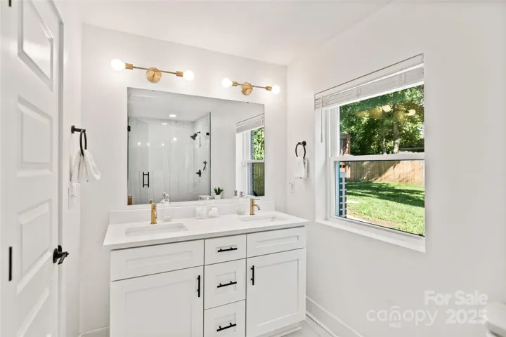 Ensuite bathroom with tile floors
