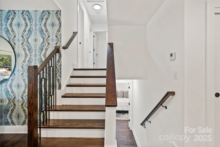 3 bedrooms + 1 bath upstairs, primary bedroom downstairs. Gorgeous banister