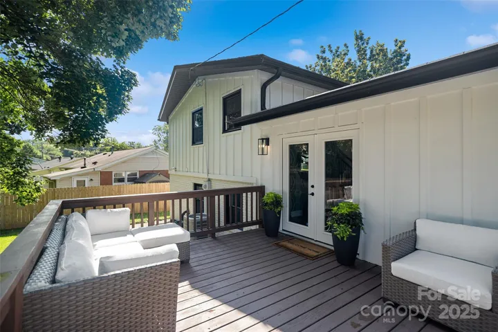 Clean & freshly painted back porch with access to the dining area