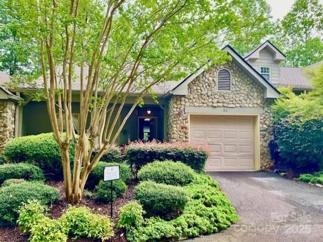 Top Level with attached garage beautiful stone work