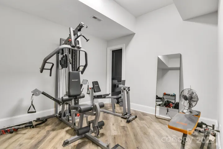 Flex room used as exercise room, with walk-in closet.