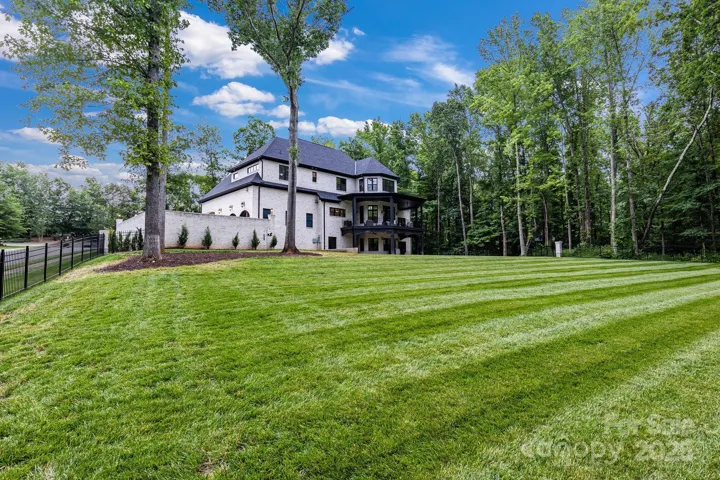 Fenced in back yard - 60" black aluminum fencing with pool approved gates/and plunge latches.