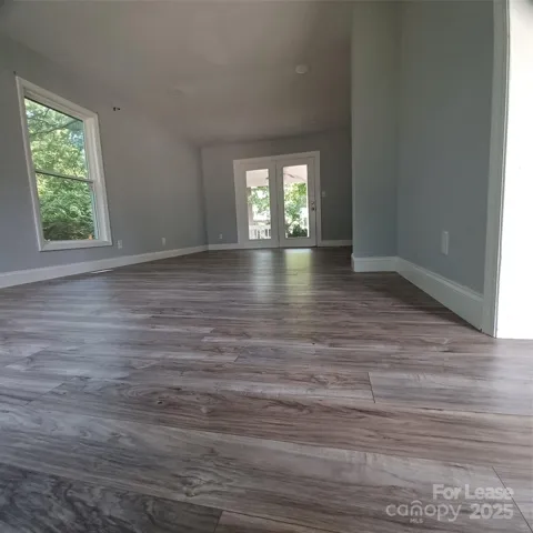 Family Room measuring 12 x 24 leading to 8 x 12 covered porch with french doors