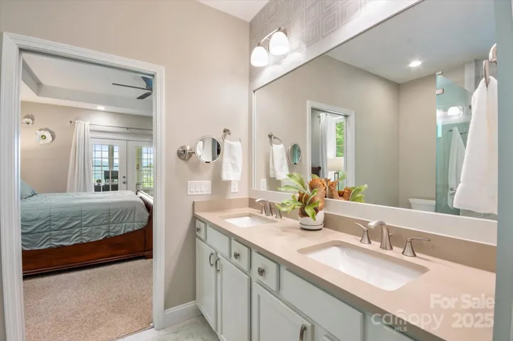 Primary ensuite with double vanity.