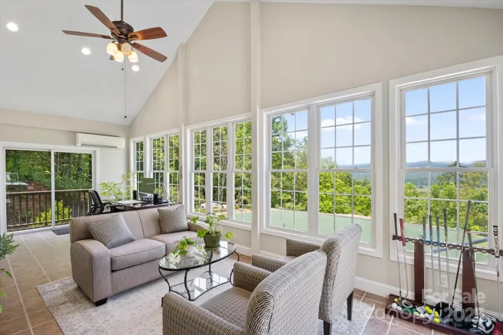 Light, airy four season room overlooking putting  green.