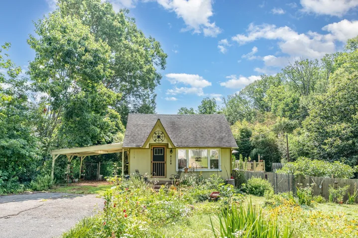 Welcome home to this cozy cottage nestled in a serene and inviting landscape