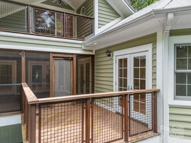 Cantilevered deck accessed by the screened porch and primary bedroom.