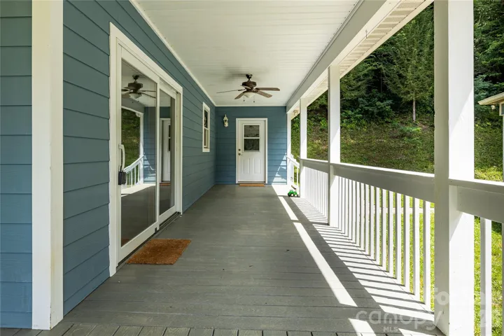 Side entrance off the porch leads to mudroom/laundry room