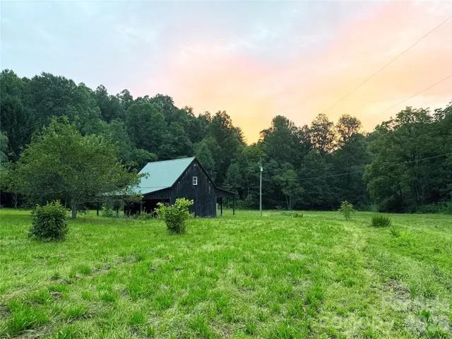 Sunset view over the barn and trees