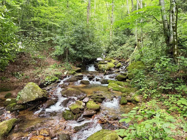 Bold creek with cascading waterfalls heard from primary bedroom